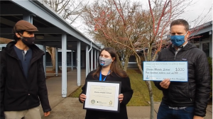 Mr. Cottle & Ms. Slagle, receiving the Premier Green School Certificate.